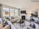 Bright living room featuring a fireplace, large windows and an open concept layout at 4625 Potters Wheel Dr, Fort Mill, SC 29715