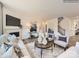 Bright living room with a fireplace, stairs to second floor, and neutral decor at 4625 Potters Wheel Dr, Fort Mill, SC 29715
