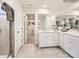 This main bathroom features a double sink vanity, walk-in shower, and a view into the walk-in closet at 4625 Potters Wheel Dr, Fort Mill, SC 29715