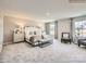 This spacious main bedroom is elegantly appointed with stylish furnishings, neutral decor, and plush carpeting at 4625 Potters Wheel Dr, Fort Mill, SC 29715
