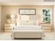 Inviting bedroom showcasing a comfortable bed with soft linens, side tables and lamps at 4633 Potters Wheel Dr, Fort Mill, SC 29715