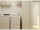 Functional laundry room featuring washer, dryer, shelving, and storage baskets at 4633 Potters Wheel Dr, Fort Mill, SC 29715