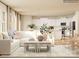 Open-concept living room featuring a comfortable sofa, stylish decor, and an adjacent kitchen area at 4633 Potters Wheel Dr, Fort Mill, SC 29715