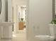 Well-lit bathroom with a pedestal sink, and view to the bedroom area at 4641 Potters Wheel Ct, Fort Mill, SC 29715