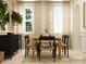 Dining room with modern decor, a wooden table, and neutral color palette at 4641 Potters Wheel Ct, Fort Mill, SC 29715