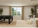 Open-concept living area with ample natural light and views, with a foosball table at 4641 Potters Wheel Ct, Fort Mill, SC 29715