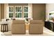 Cozy living room with neutral tones, plush seating, and large windows at 4641 Potters Wheel Ct, Fort Mill, SC 29715