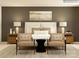 Inviting main bedroom boasts a luxurious bed, accent seating, and stylish bedside tables at 4641 Potters Wheel Ct, Fort Mill, SC 29715