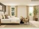 Tranquil main bedroom filled with natural light, complemented by elegant furnishings and decor at 4641 Potters Wheel Ct, Fort Mill, SC 29715