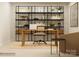 Modern office featuring a sleek wooden desk, open shelving, and minimalist decor at 4641 Potters Wheel Ct, Fort Mill, SC 29715