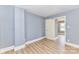 Bright bedroom features wood flooring, gray walls, and a window, creating a serene living space at 4924 Jane Ave, Charlotte, NC 28269
