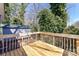 Spacious wooden deck perfect for outdoor entertaining, complemented by lush greenery and a storage shed at 4924 Jane Ave, Charlotte, NC 28269