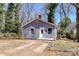 Quaint one-story home featuring gray siding, white trim, and a concrete driveway at 4924 Jane Ave, Charlotte, NC 28269