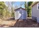 Exterior view of the gray storage shed in the backyard at 4924 Jane Ave, Charlotte, NC 28269