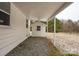 Backyard exterior featuring a white shed with a gravel base and covered porch at 5028 Wilgrove Mint Hill Rd, Mint Hill, NC 28227