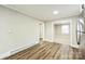Inviting dining area featuring wood-look floors, opening up to various rooms with natural light at 5028 Wilgrove Mint Hill Rd, Mint Hill, NC 28227
