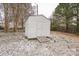 A backyard shed with a ramp offers extra storage in a snow dusted backyard at 5028 Wilgrove Mint Hill Rd, Mint Hill, NC 28227