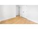 Neutral bedroom with light hardwood floors and clean white trim throughout at 5404 Maplewood Ln, Charlotte, NC 28227