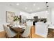 Open floor plan with a kitchen, dining room and stainless steel appliances at 5404 Maplewood Ln, Charlotte, NC 28227