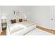 The main bedroom offers a peaceful retreat with a plush bed, warm lighting and minimal decor at 5404 Maplewood Ln, Charlotte, NC 28227