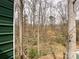 View of backyard with trees and greenery as seen from deck at 5610 Stone Bluff Ct, Charlotte, NC 28214