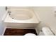 Bathroom features bathtub, toilet, and hardwood floors at 5610 Stone Bluff Ct, Charlotte, NC 28214