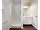 Bathroom with walk-in shower, white vanity, and modern lighting at 5610 Stone Bluff Ct, Charlotte, NC 28214