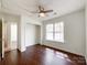 Cozy bedroom featuring ceiling fan, vaulted ceiling and large window at 5610 Stone Bluff Ct, Charlotte, NC 28214