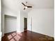 Light-filled bedroom features ceiling fan, vaulted ceiling and closet at 5610 Stone Bluff Ct, Charlotte, NC 28214