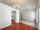 Inviting dining area with a chandelier and view of the kitchen at 5610 Stone Bluff Ct, Charlotte, NC 28214