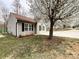 Charming single-story home with a well-manicured front yard with mature tree at 5610 Stone Bluff Ct, Charlotte, NC 28214
