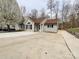 Charming single-story home with a well-manicured lawn and extended driveway at 5610 Stone Bluff Ct, Charlotte, NC 28214