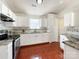 Well-equipped kitchen featuring white cabinets, granite counters, and tile backsplash at 5610 Stone Bluff Ct, Charlotte, NC 28214