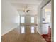 Inviting living room featuring tile flooring, ceiling fan, and plenty of natural light at 5610 Stone Bluff Ct, Charlotte, NC 28214