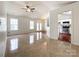 Bright living room with tile floors, ceiling fan, and view of the kitchen at 5610 Stone Bluff Ct, Charlotte, NC 28214