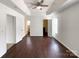 Expansive primary bedroom showcasing tray ceilings and multiple doorways at 5610 Stone Bluff Ct, Charlotte, NC 28214