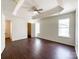 Spacious primary bedroom featuring a ceiling fan and large windows at 5610 Stone Bluff Ct, Charlotte, NC 28214