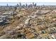 Drone shot showing property's proximity to uptown, businesses, roads, and green spaces within the city skyline at 701 S Torrence St, Charlotte, NC 28204