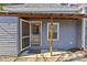Charming side porch featuring wooden columns, a screen door, and stone pavers, enhancing the home's character at 701 S Torrence St, Charlotte, NC 28204