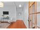 Bright foyer with hardwood floors and a charming view into the open-concept living space at 701 S Torrence St, Charlotte, NC 28204