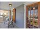 Inviting front porch with seating area, natural wood door, and decorative wood window shutters, #701 at 701 S Torrence St, Charlotte, NC 28204