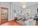 Inviting living room with plenty of natural light, showcasing stylish decor and access to the front entrance at 701 S Torrence St, Charlotte, NC 28204