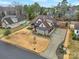 Sprawling home with lush green trees, a long driveway, and manicured lawn at 894 Abilene Ln, Fort Mill, SC 29715