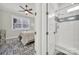 Bathroom featuring a tiled shower and a view into the bedroom from the door frame at 894 Abilene Ln, Fort Mill, SC 29715