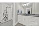 Bright bathroom featuring a modern vanity and shower with a decorative shower curtain at 894 Abilene Ln, Fort Mill, SC 29715
