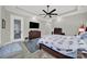 Bedroom showcasing a ceiling fan, TV, and access to the outdoors at 894 Abilene Ln, Fort Mill, SC 29715