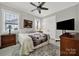 Bright bedroom features a ceiling fan, windows with blinds, and a closet for storing your wardrobe at 894 Abilene Ln, Fort Mill, SC 29715