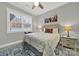 Well-lit bedroom featuring a window, ceiling fan, stylish rug, and neutral decor for a calming space at 894 Abilene Ln, Fort Mill, SC 29715
