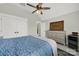 Bedroom showcasing a ceiling fan, dresser, and a mini refrigerator at 894 Abilene Ln, Fort Mill, SC 29715