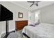 Bedroom featuring a ceiling fan, window, hardwood floors, a TV, and a closet for clothing storage at 894 Abilene Ln, Fort Mill, SC 29715